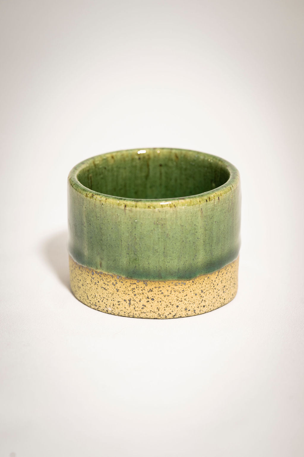 Speckled green ceramic ramekin.