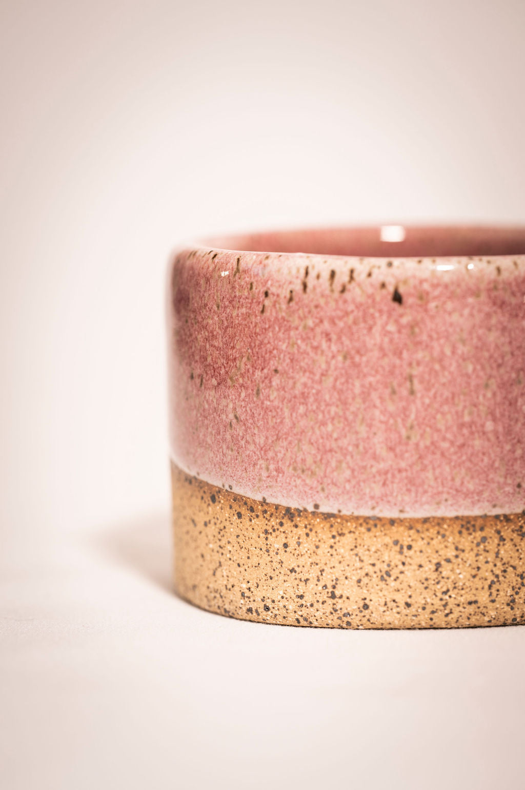 Detail and close up shot of speckled pink ceramic ramekin.