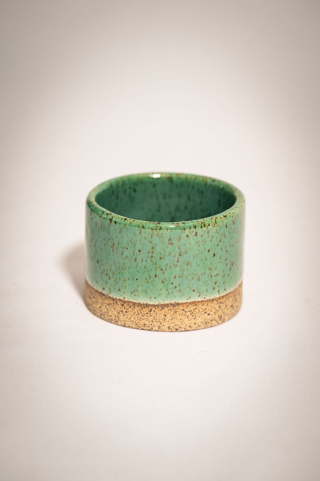 Speckled turqoise ceramic ramekin.