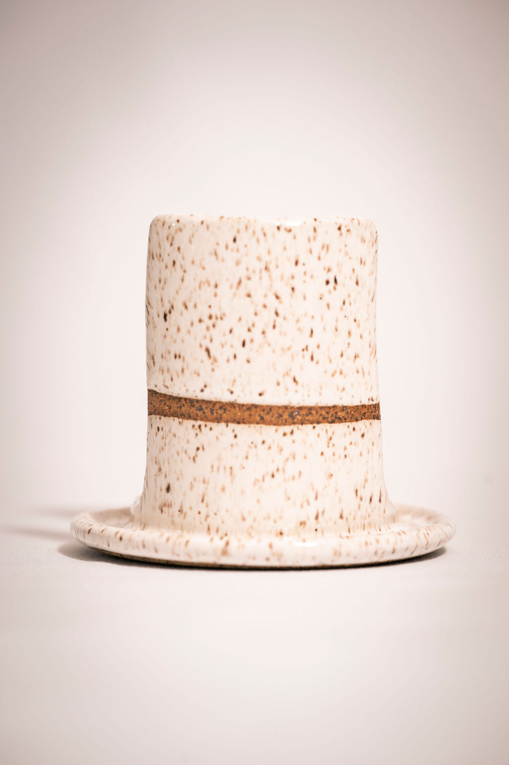 White speckled ceramic sponge holder front view.