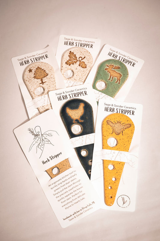 Set of herb stripper tools packaged on white cards with illustrations on a beige background